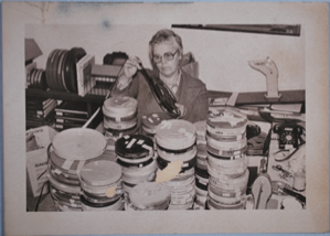 Image of Barbara Kaster working with Arctic film reels, "Green Seas, White Ice"